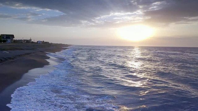 drone flying over the blacksea coast on sunset 