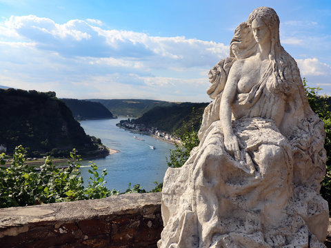 Loreley (heine) by Rhine in Germany. Beautiful view from the high cliff and the famous statue on top of it who is telling. 