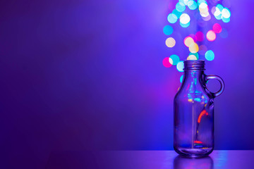 Glass bottle with bokeh background