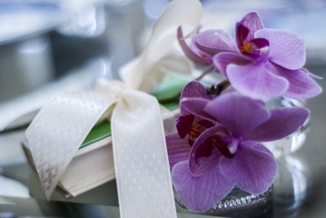 Orchid, Book, and Ribbon