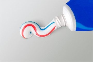 Tube of toothpaste close up on  background