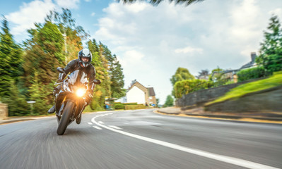 motorbike on the road riding. having fun riding the empty road on a motorcycle tour / journey