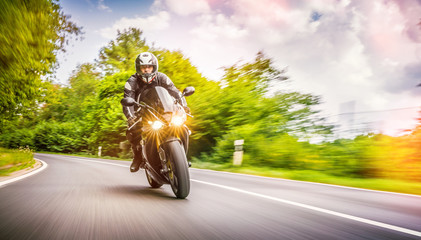 motorbike on the road riding. having fun riding the empty road on a motorcycle tour / journey
