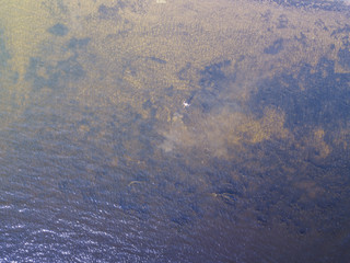 aerial top view of summer thailand resort beach, man swimming in sea