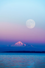 Mountain Baker and full moon with sunset sky backgrounds