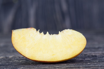 one fresh slice of ripe peach