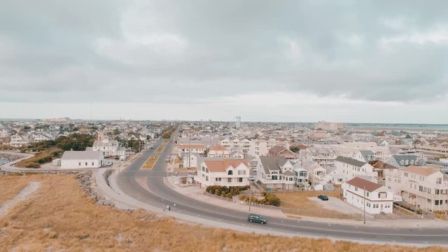 Aerial Of Beach Town With Beachfront Homes And Condos On Cloudy Sunrise Day Wildwood New Jersey