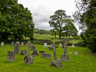 Old village cemetery with ancient stone gravestones