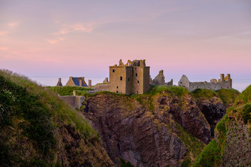 Pink light on the ruin of Dunnottar castle 