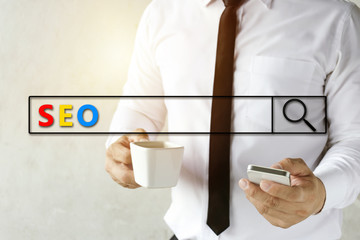 Businessman are using smartphones to find information. SEO concept.