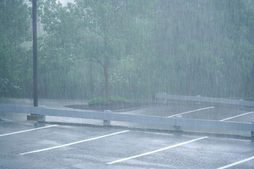 parking lot in the heavy rain in summer thunderstorm