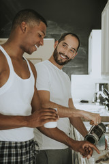Gay couple cooking in the morning