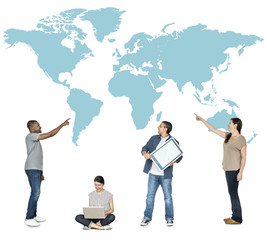 Diverse people pointing at a map