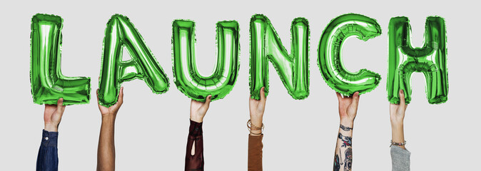 Hands showing launch balloons word