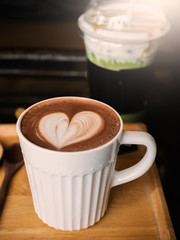 Hot chocolate cup on wood table.