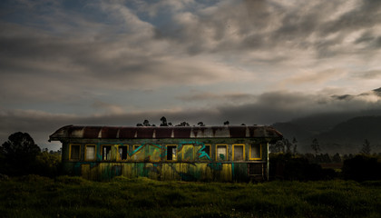 Obraz premium Abandoned train car in a sunset