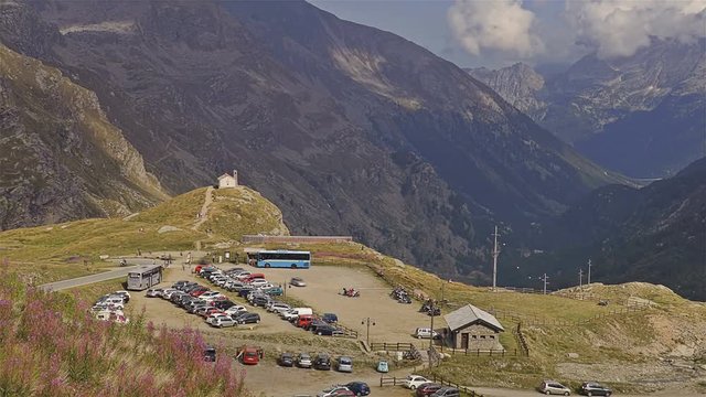 Small church in the alpine panorama. Gran Paradiso National Park - Time lapse. Italy