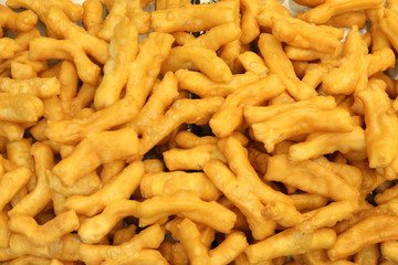 Many deep fried dough stick as background view on top
