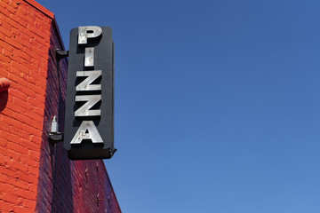 Broken neon Pizza sign