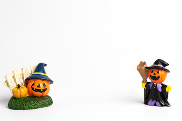 Halloween pumpkins with a fence and wizard pumpkin halloween and center copy space.