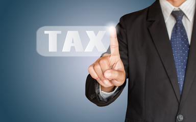 Businessman hand touching TAX button, Touch Screen Concept