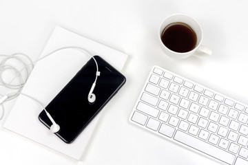 Minimal white bussiness workspace with cup of espresso