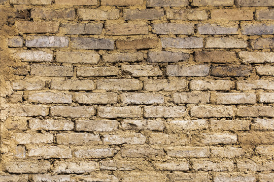 Texture bricks soil wall of Earth house is the material for building traditional earthen house.