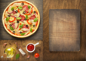 pizza and food ingredients at wooden table