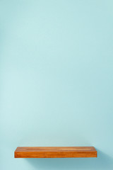 woden shelf at abstract wall background