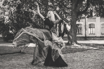 Halloween concept, lady in witch costume, Portrait of a woman in vintage gothic dress, celebration autumn party. Attractive modern witch Fairy Tales. Halloween 