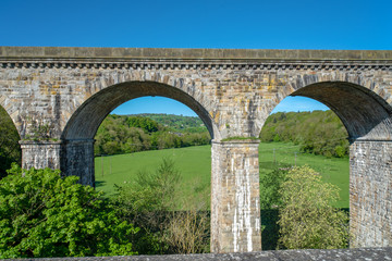 View of the Chirk railway viaduct from a narrowboat on the Chirk Aquaduct. The later built Railway viaduct runs alongside the navigable aquaduct.
