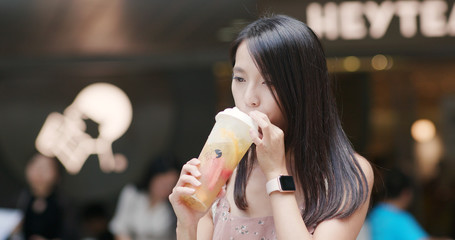 Woman enjoy iced tea take away in shenzhen city