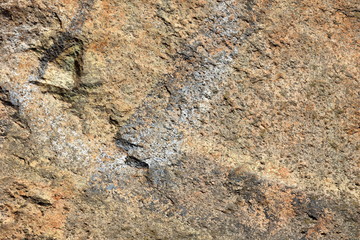 Granite background. Granite stone close up. Texture of natural material. Rocky rocks of ancient times. Natural pattern