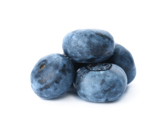 Tasty juicy ripe blueberries on white background