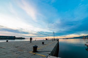 Colorful sunset in front of the city of Trieste