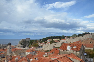 Fototapeta na wymiar Old City of Dubrovnik has managed to preserve its gothic, renaissance and baroque churches, monasteries, fortress & fountains. Red rooftops are the iconic look of the old city.