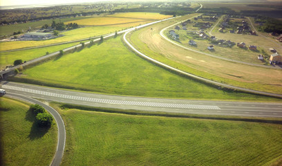 Aerial Top View of highway intersection junction summer morning with car