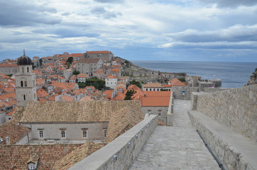 Fototapeta na wymiar Old City of Dubrovnik has managed to preserve its gothic, renaissance and baroque churches, monasteries, fortress & fountains. Red rooftops are the iconic look of the old city.