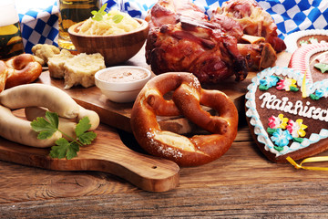 Traditional German cuisine, Schweinshaxe roasted ham hock. Beer, pretzels and various Bavarian specialties. Oktoberfest background