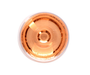 Glass of rose champagne on white background, top view