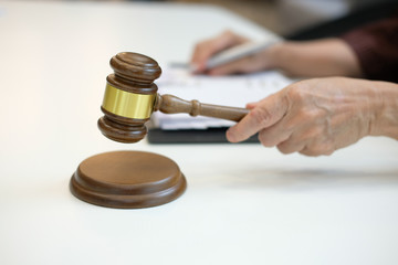 judge holding legal law gavel with book at courtroom. lawyer attorney justice