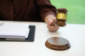 judge holding legal law gavel with book at courtroom. lawyer attorney justice