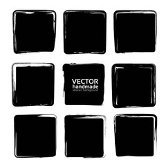 Square smears of black textured brush strokes set isolated on a white background