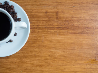 Coffee is a brewed drink prepared from roasted coffee beans, Coffee cup and coffee beans on a...