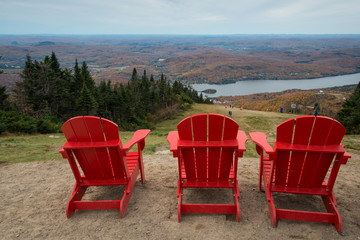 Three red chairs at the top of Mont Tremblant, Quebec, Canada