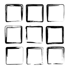 Square smears of black ink textured brush strokes isolated on a white background