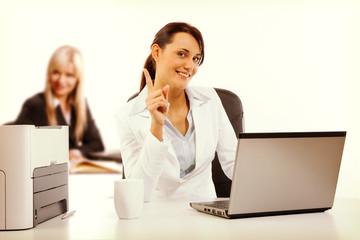 Two attractive business womana working at the office