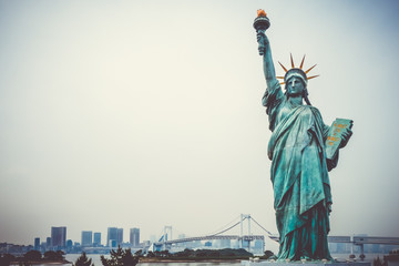 Statue of liberty and tokyo cityscape, Japan © daboost