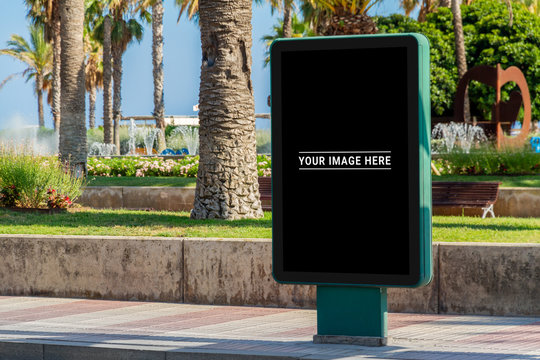 Outdoor billboard advertisement in seaside resort city mockup