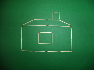 matches in the form of a house on a green background